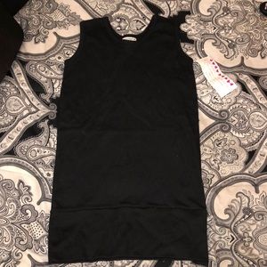 Black sleeveless top with a band on the bottom. Size extra large NWT.